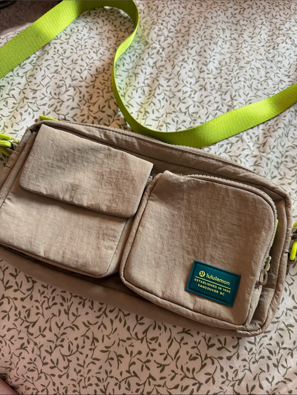 lululemon athletica beige crossbody bag with neon green strap